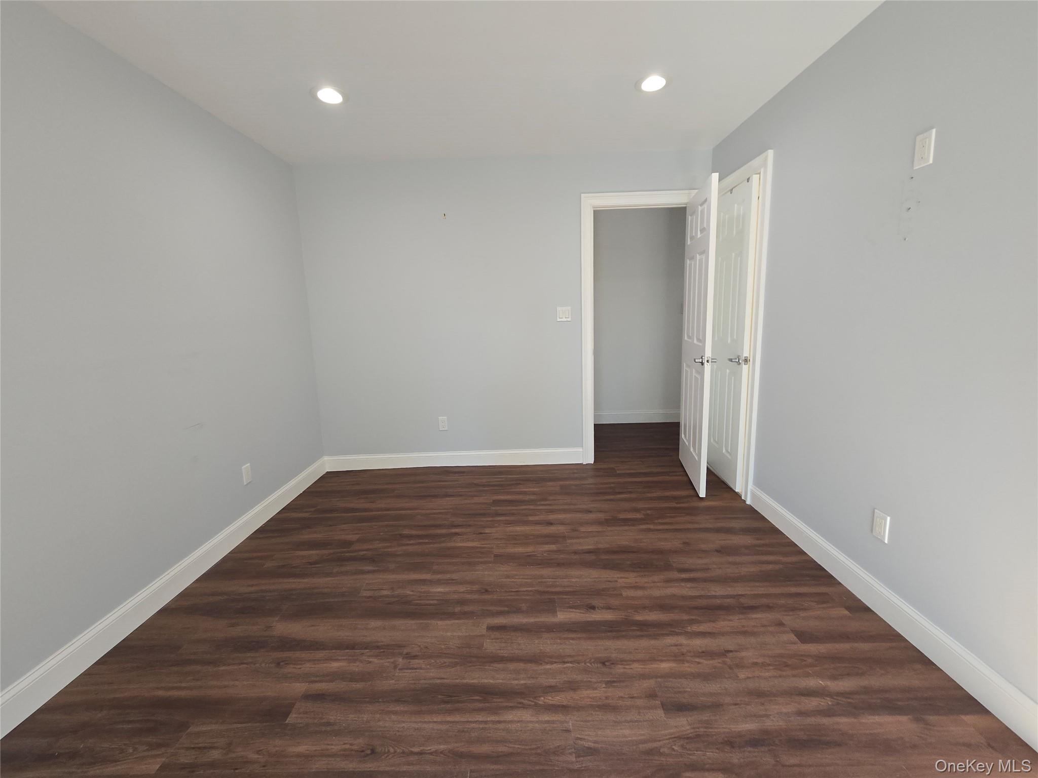 32 Valley Road Old Westbury, NY 11568 - Photo 20 of 45 Unfurnished bedroom featuring recessed lighting and dark wood finished floors