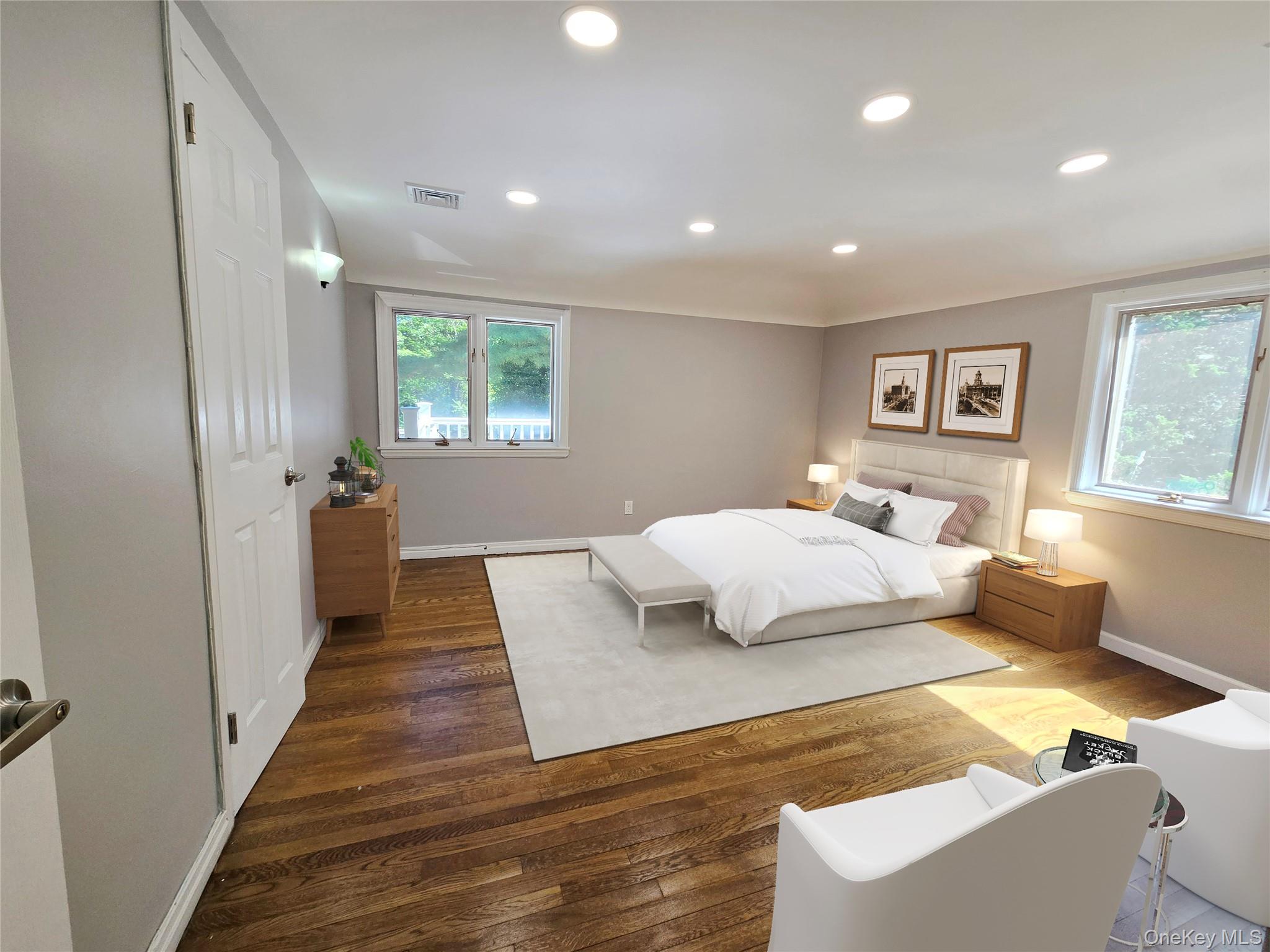 32 Valley Road Old Westbury, NY 11568 - Photo 25 of 45 Bedroom featuring wood finished floors, multiple windows, and recessed lighting