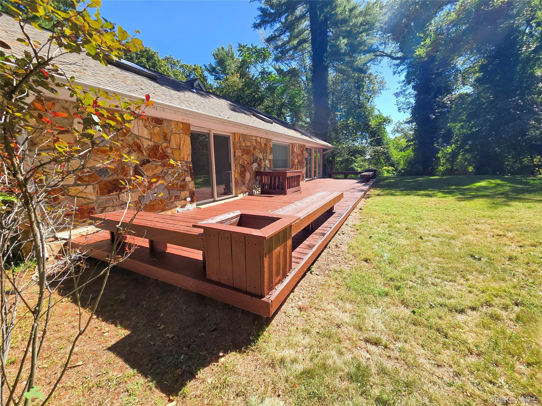 32 Valley Road Old Westbury, NY 11568 - Photo 5 of 45 Wooden deck with a yard