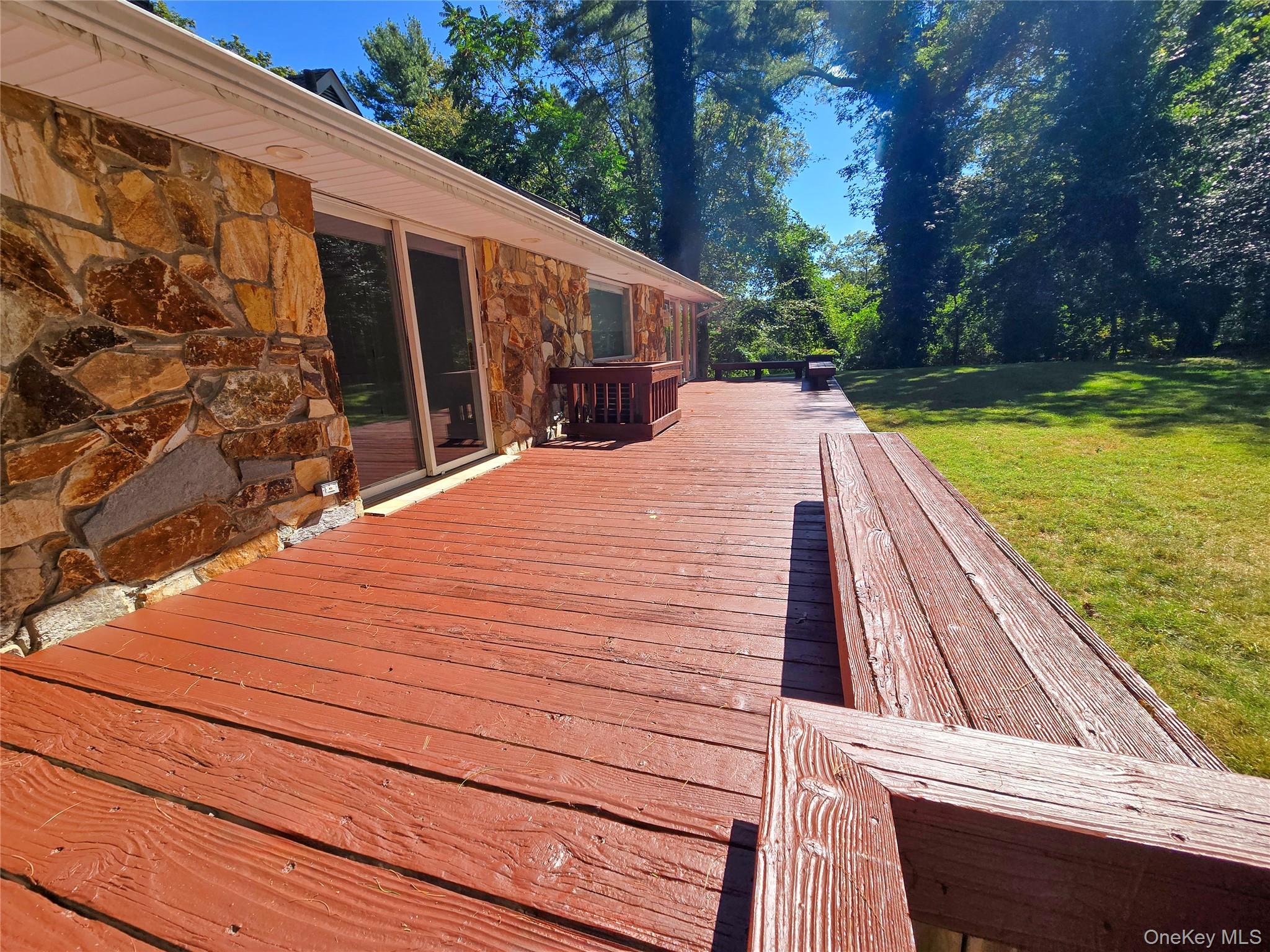 32 Valley Road Old Westbury, NY 11568 - Photo 6 of 45 Deck featuring a lawn