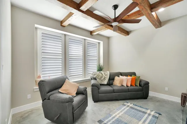 a view of a livingroom with furniture and a flat screen tv