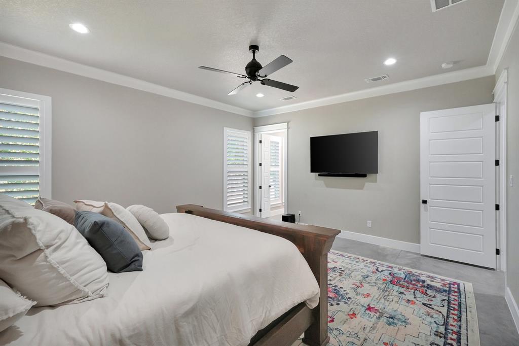 516 West Spring Street Weatherford, TX 76086 - Photo 15 of 39 a bedroom with a bed tv and window