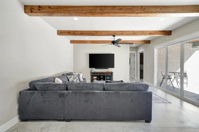 a living room with furniture and a rug