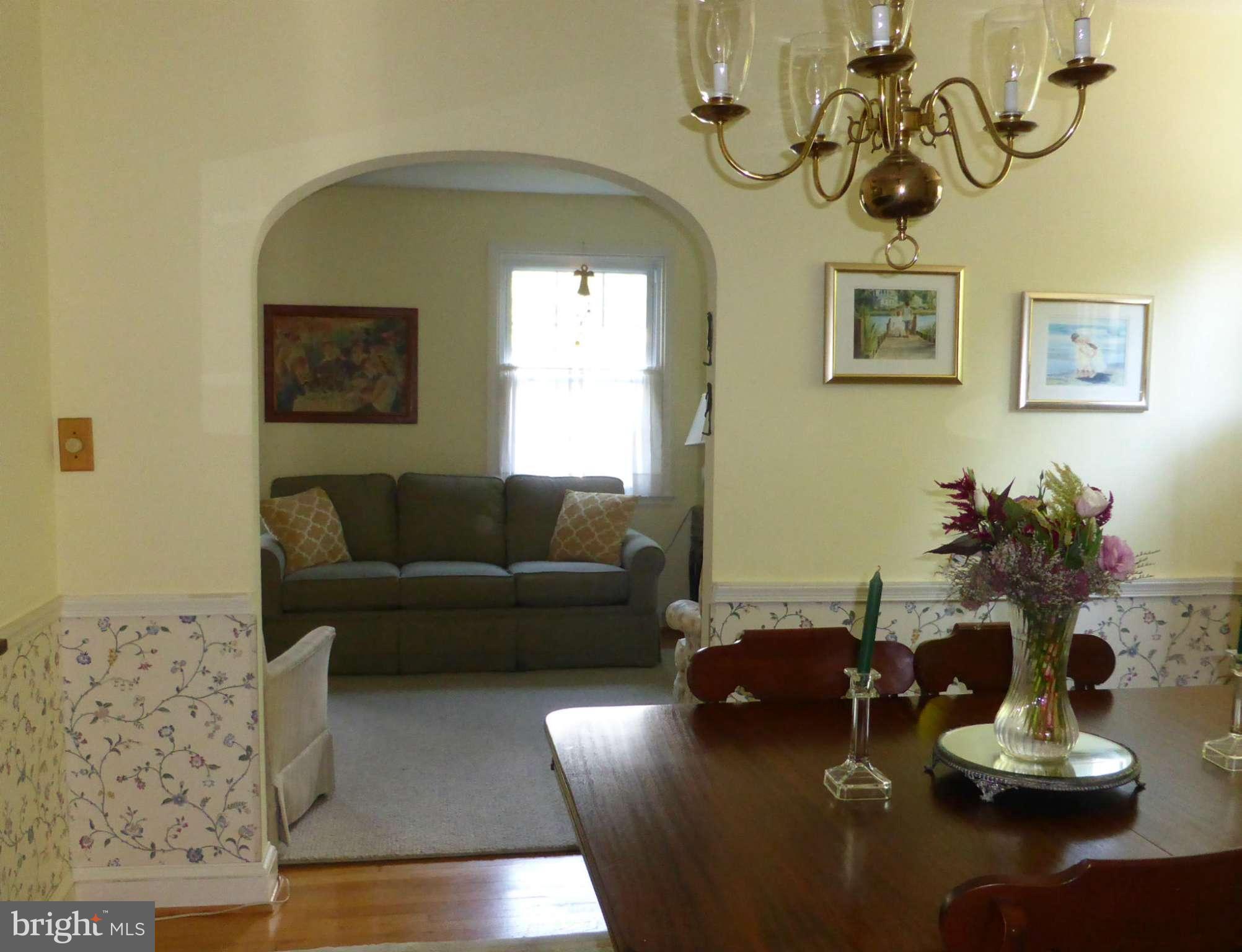 733 Anneslie Road Baltimore, MD 21212 - Photo 4 of 11 a living room with furniture and a chandelier
