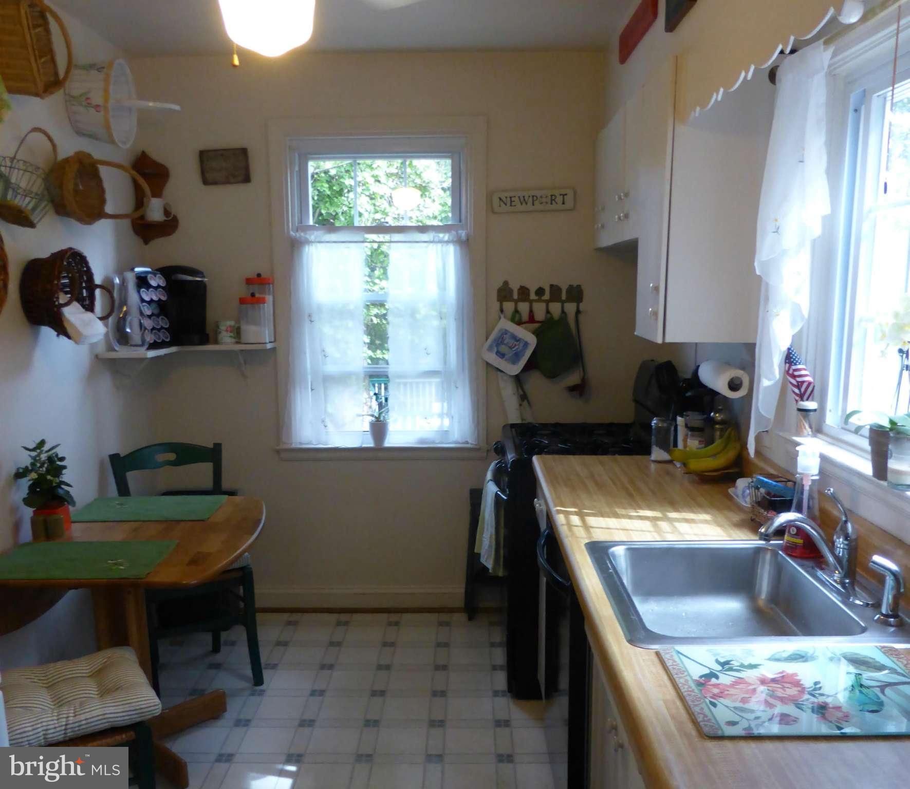 733 Anneslie Road Baltimore, MD 21212 - Photo 8 of 11 a kitchen with a stove a sink and a microwave