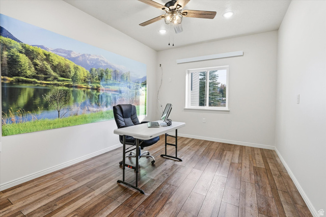 165 Main Street Georgetown, ID 83239 - Photo 7 of 50 Home office with wood finished floors, a ceiling fan, recessed lighting, and a mountain view