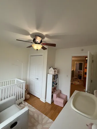 a living room with furniture and chandelier