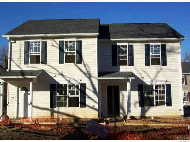a front view of a house with yard