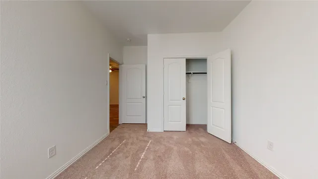 an empty room with a hallway