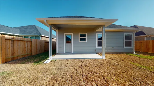 a house with yard in front of it