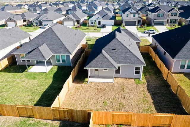 a aerial view of a house with a yard