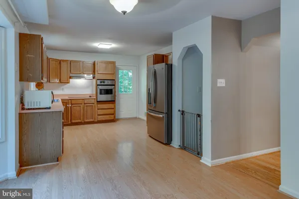 a view of kitchen with wooden floor