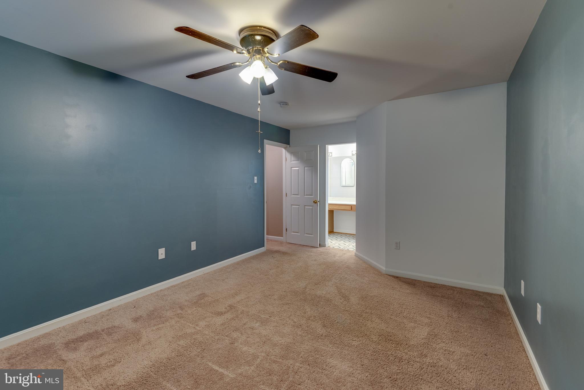8413 Manor View Road Lusby, MD 20657 - Photo 20 of 48 an empty room with chandelier fan and windows