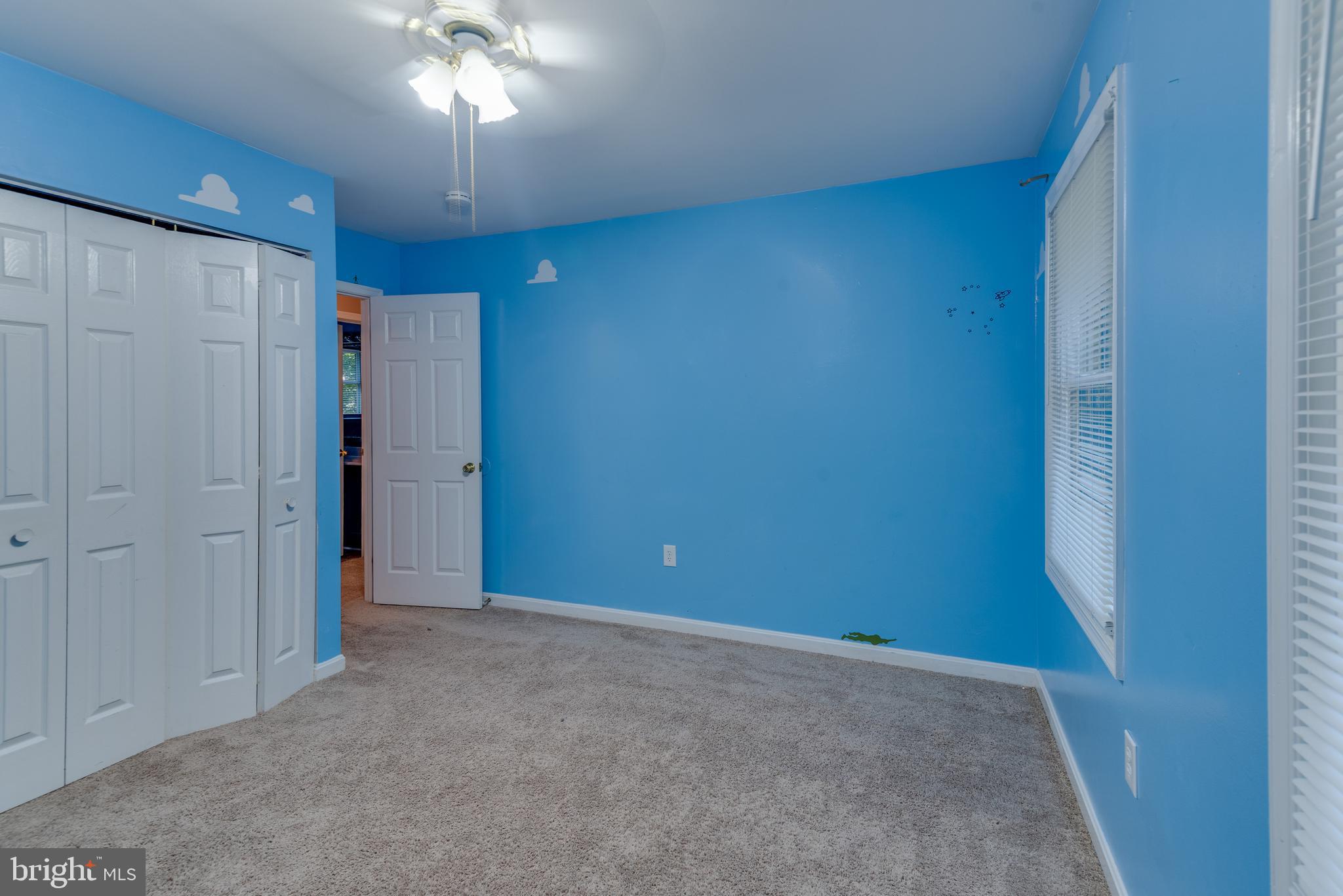 8413 Manor View Road Lusby, MD 20657 - Photo 30 of 48 a view of an empty room with a chandelier fan