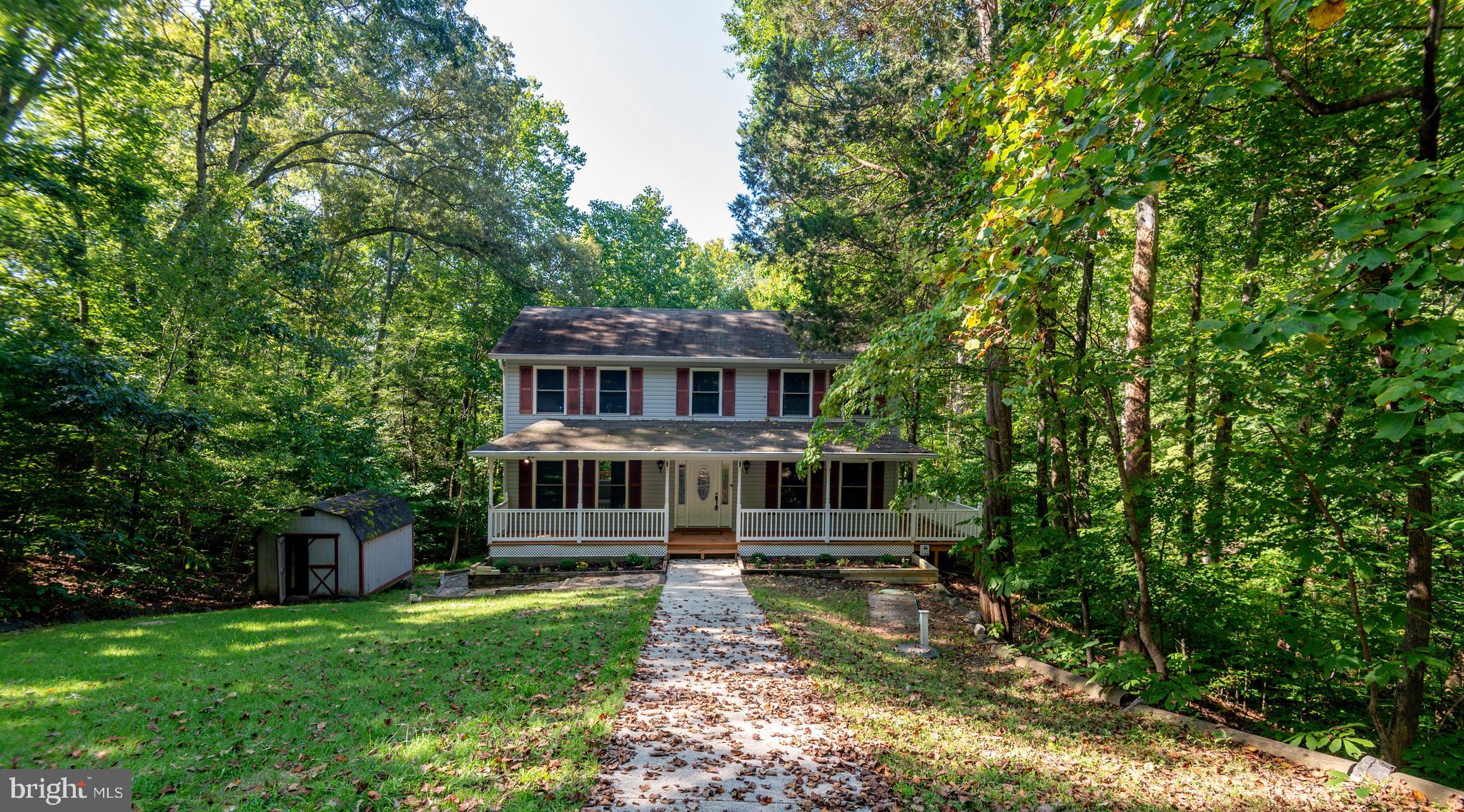 8413 Manor View Road Lusby, MD 20657 - Photo 35 of 48 a view of a house with a yard