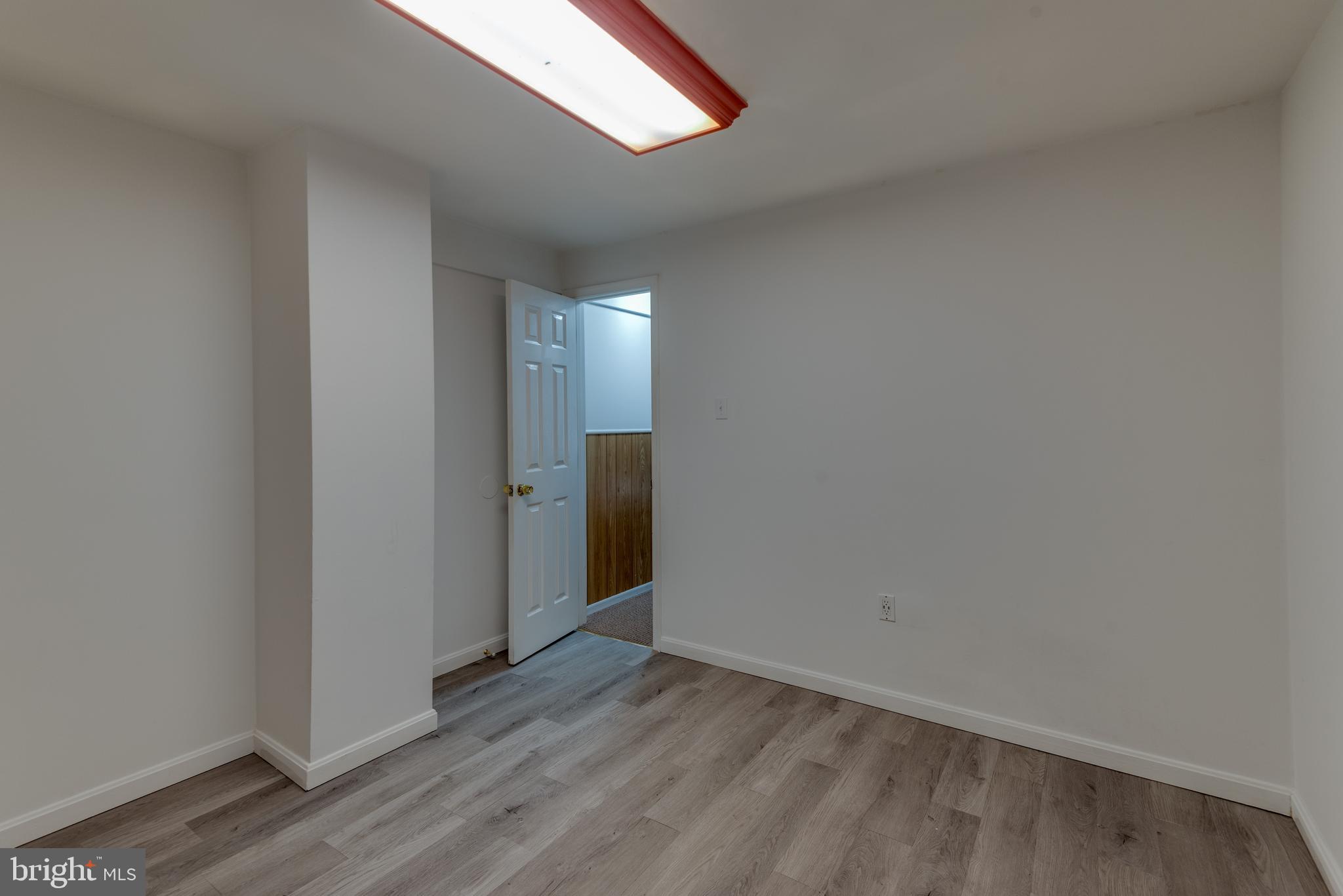 8413 Manor View Road Lusby, MD 20657 - Photo 38 of 48 a view of empty room with wooden floor
