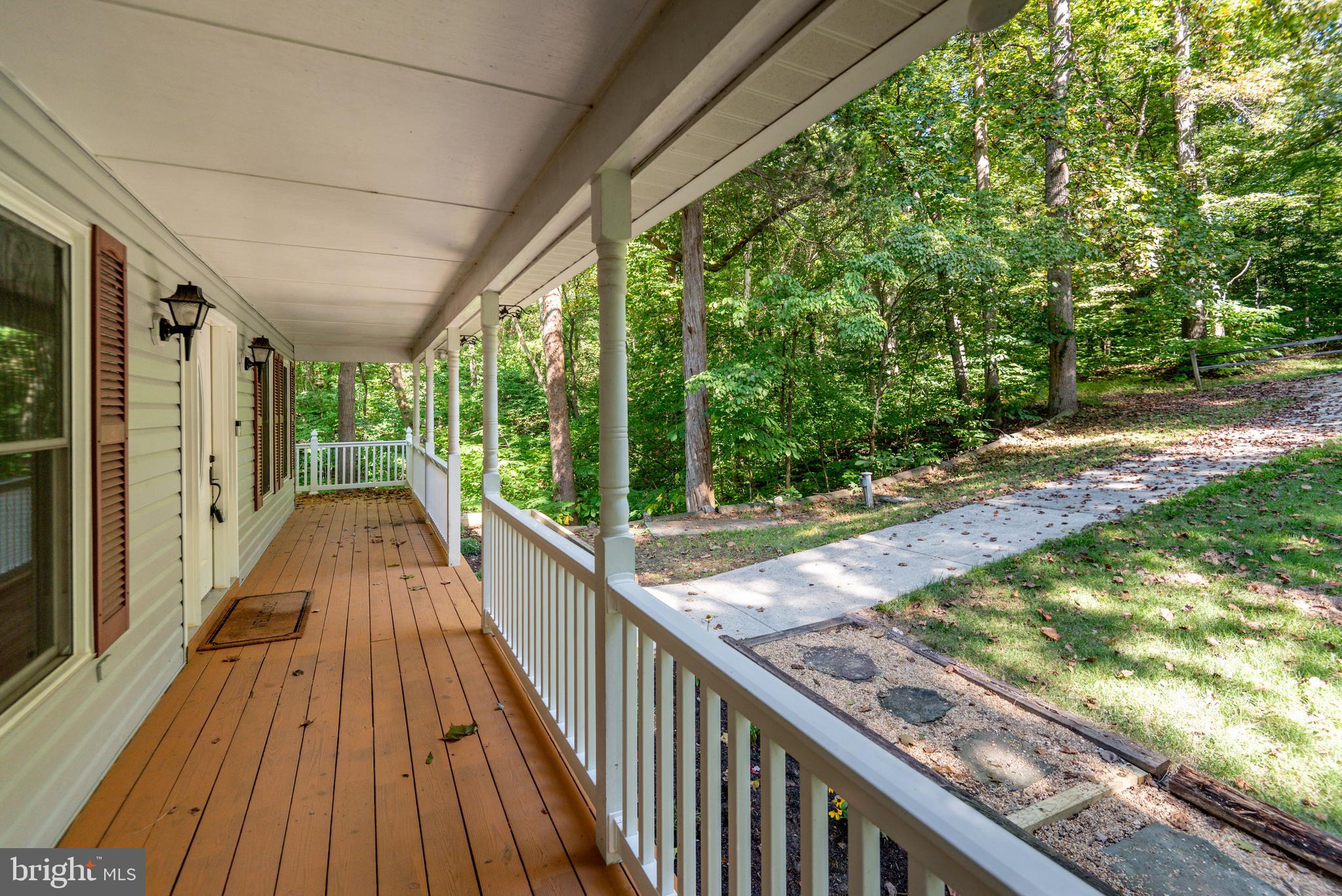 8413 Manor View Road Lusby, MD 20657 - Photo 40 of 48 a view of balcony with wooden floor and fence