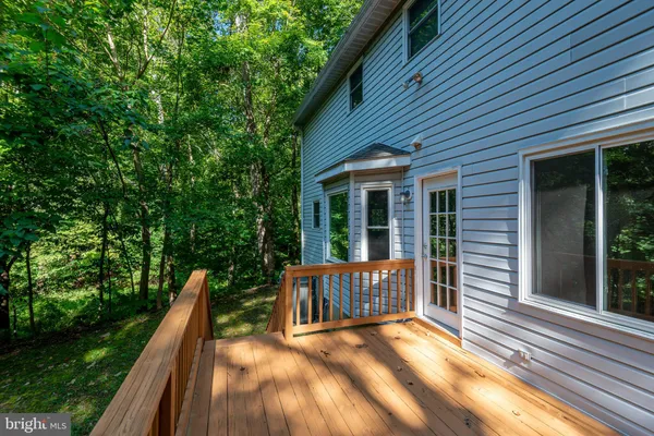 a view of a house with backyard and porch