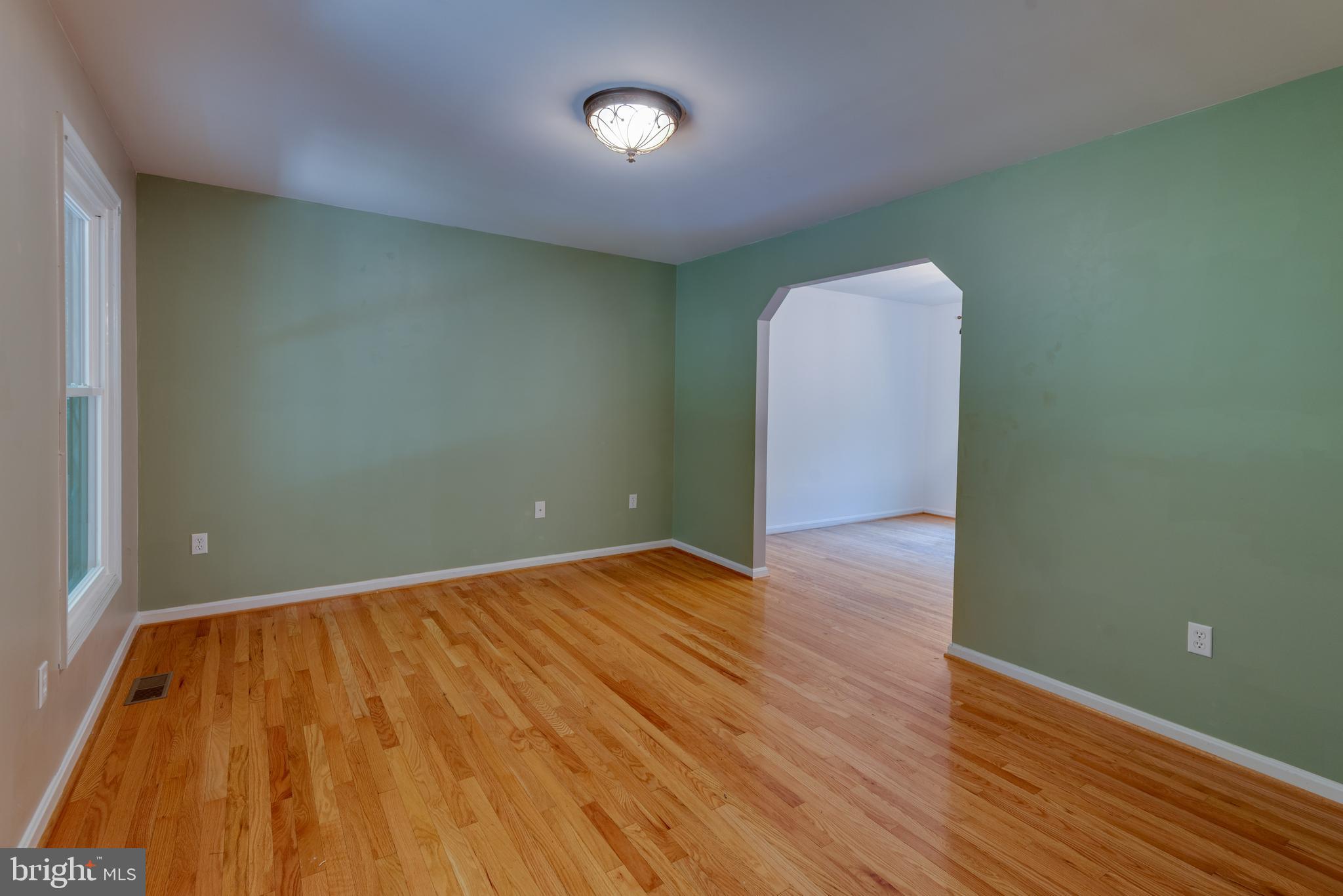 8413 Manor View Road Lusby, MD 20657 - Photo 6 of 48 a view of an empty room with wooden floor