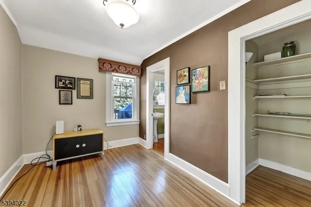 a bathroom with a sink a toilet a mirror and shower