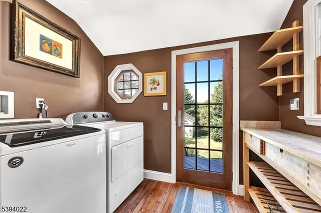 a living room with stainless steel appliances granite countertop furniture and a window