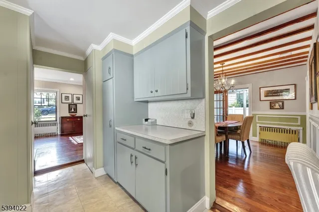 a living room with a bed furniture and a window