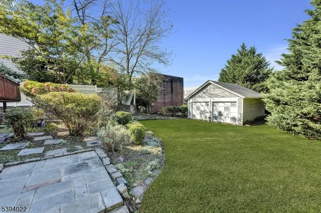 a view of a wooden chairs and table in the balcony
