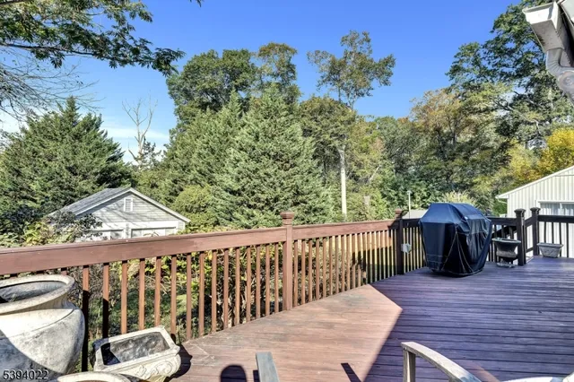 a view of a house with wooden deck