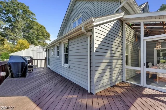 a view of a deck with two chair and a table