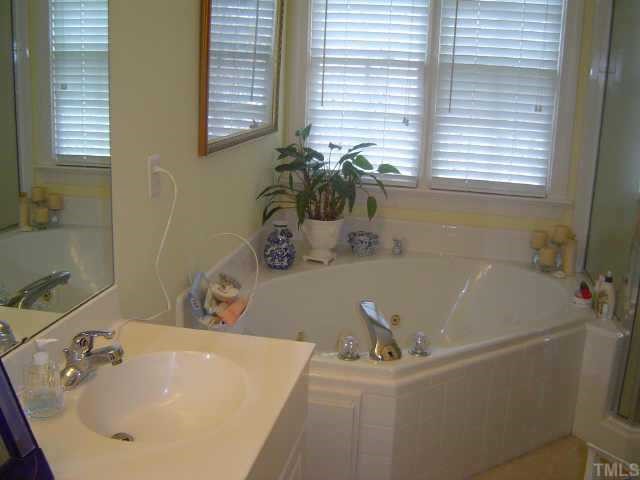 2209 St Marys Street Raleigh, NC 27608 - Photo 6 of 10 a bathroom with a sink and a window