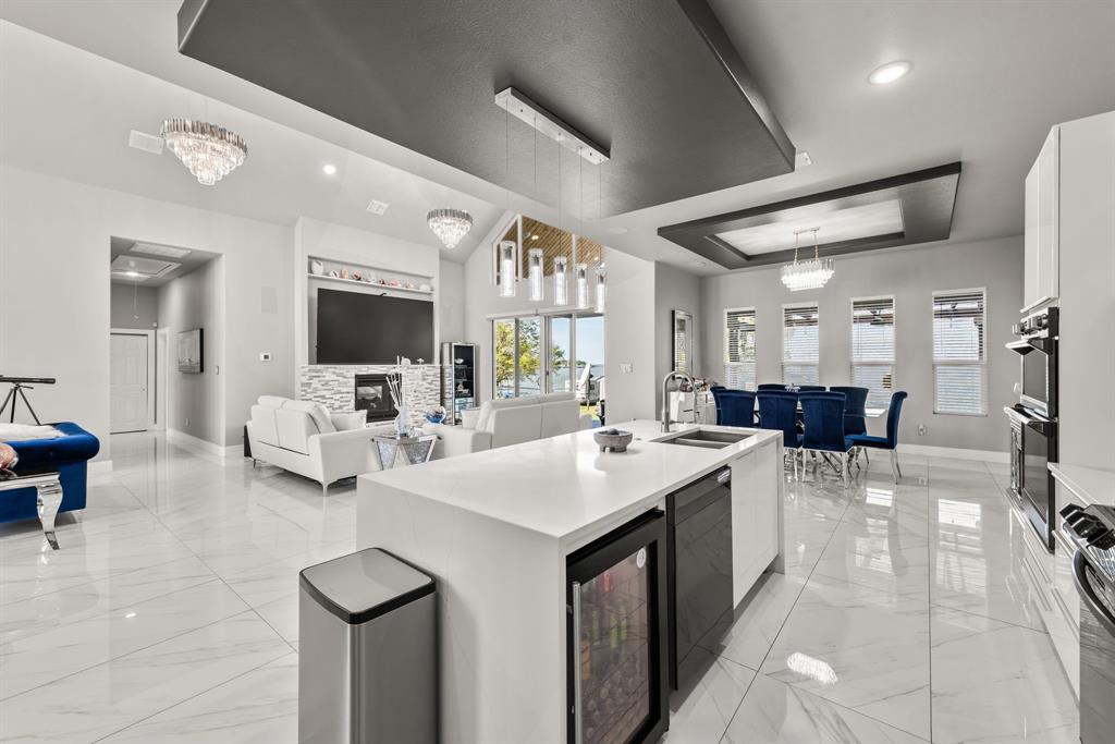 13032 Rudy's Way Streetman, TX 75859 - Photo 17 of 40 Spacious kitchen island with open sightlines to the living room and lake-facing windows.
