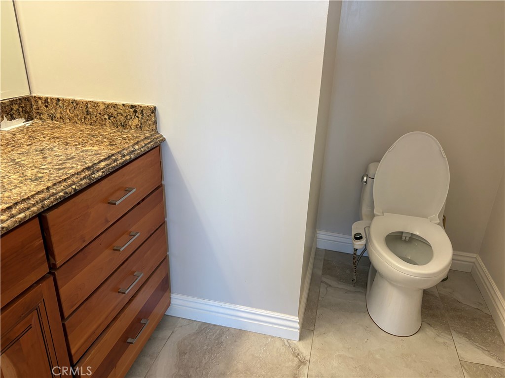 525 East Seaside Way, Unit 1505 Long Beach, CA 90802 - Photo 11 of 47 a bathroom with a sink and a toilet