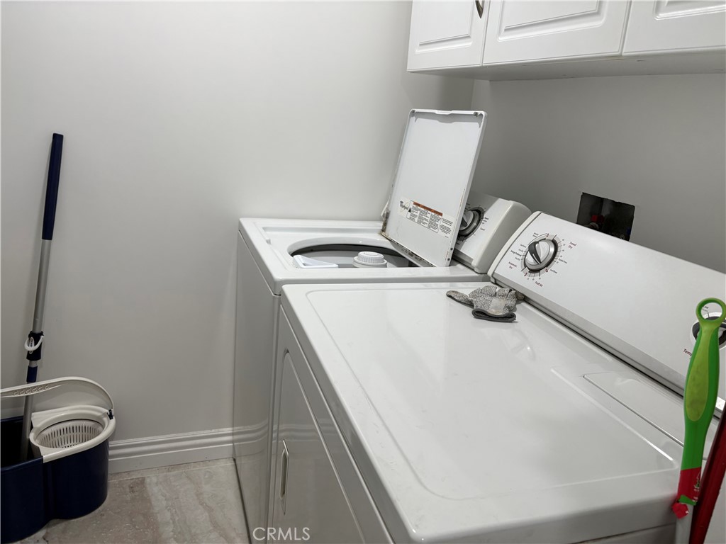 525 East Seaside Way, Unit 1505 Long Beach, CA 90802 - Photo 13 of 47 a utility room with dryer and washer