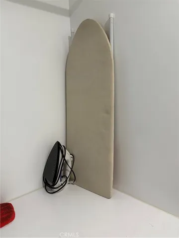 a room with a mirror and a fan