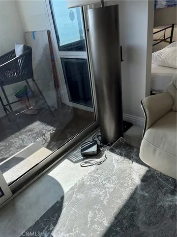 a room with wooden floor and furniture