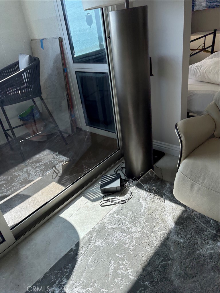 525 East Seaside Way, Unit 1505 Long Beach, CA 90802 - Photo 17 of 47 a room with wooden floor and furniture