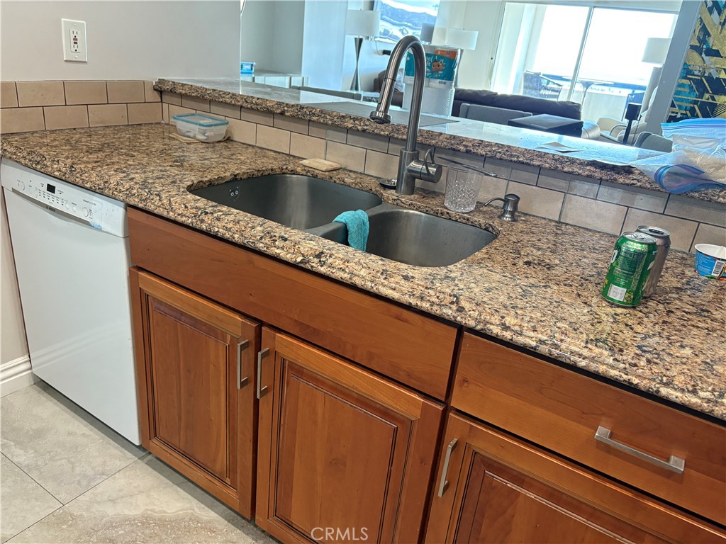 525 East Seaside Way, Unit 1505 Long Beach, CA 90802 - Photo 2 of 47 a kitchen with sink and tap