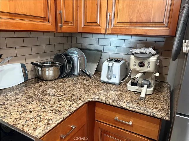 a kitchen with a stove and a cabinets