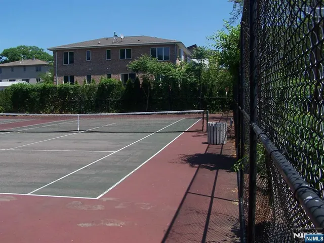 a view of a park with potted plants