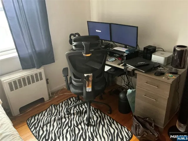 a view of workspace with wooden floor