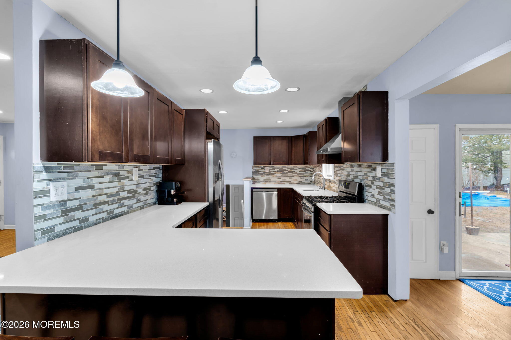 38 Hilltop Road West Long Branch, NJ 07764 - Photo 14 of 28 a kitchen with stainless steel appliances granite countertop a sink a stove and a wooden floors