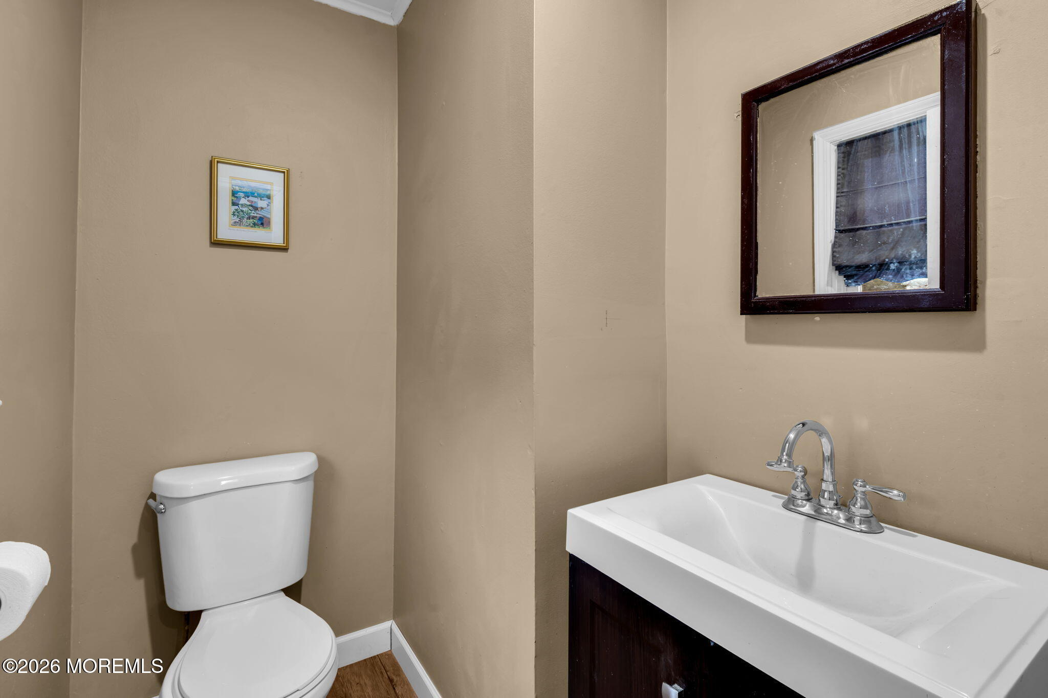 38 Hilltop Road West Long Branch, NJ 07764 - Photo 17 of 28 a bathroom with a toilet a sink and mirror