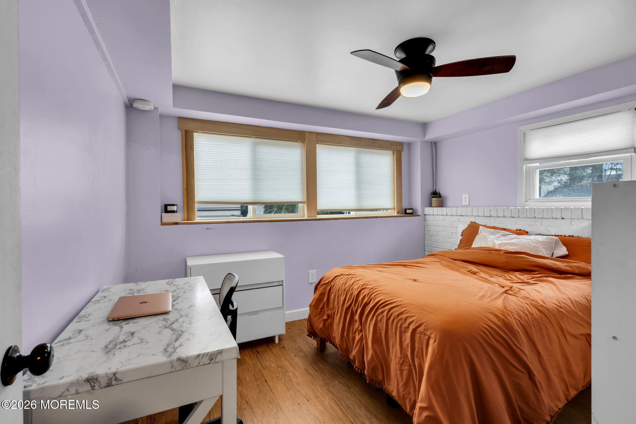 38 Hilltop Road West Long Branch, NJ 07764 - Photo 20 of 28 a bedroom with a bed and a table in it