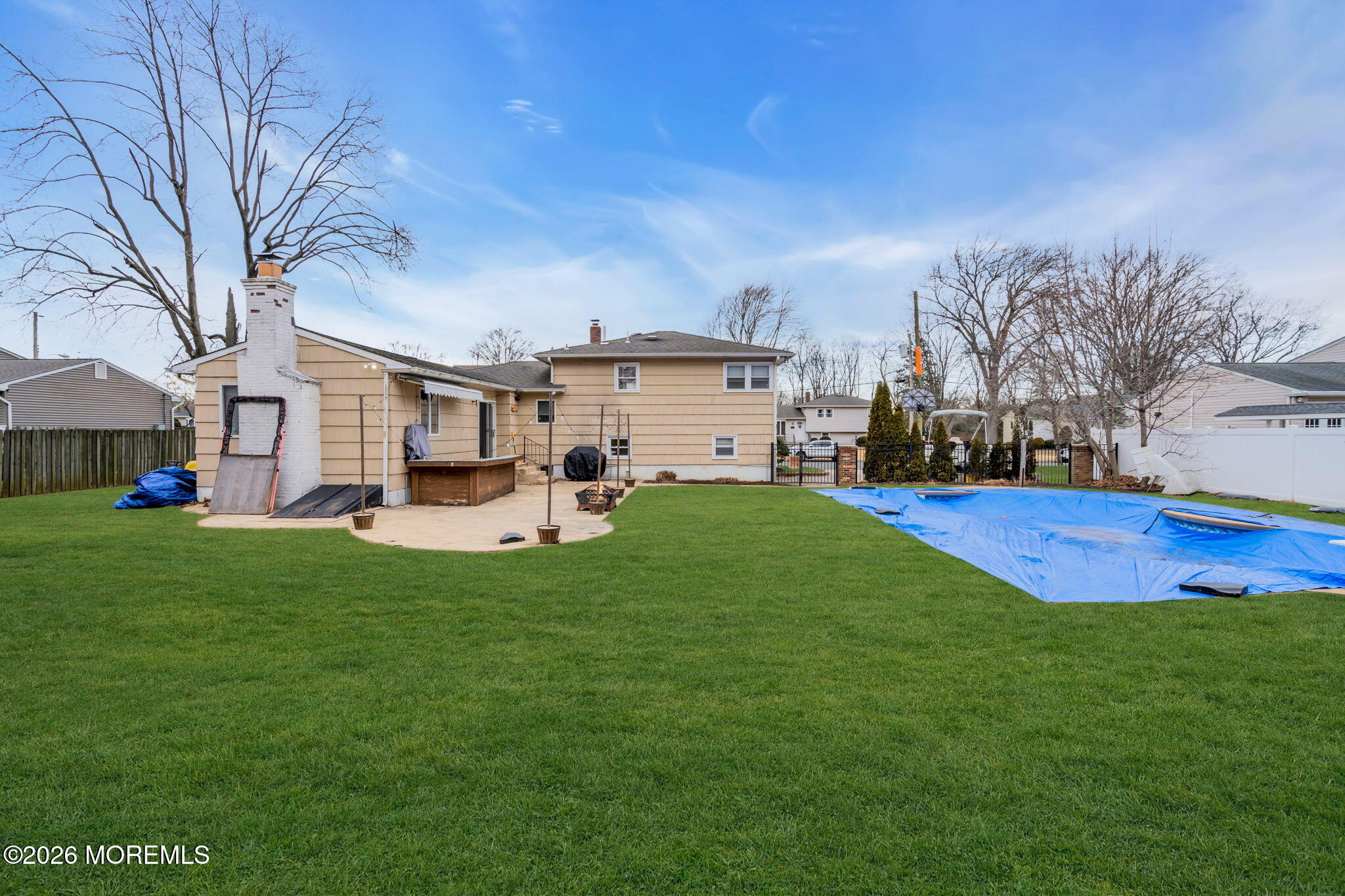 38 Hilltop Road West Long Branch, NJ 07764 - Photo 2 of 28 a view of a white house in front of a big yard with plants and large trees