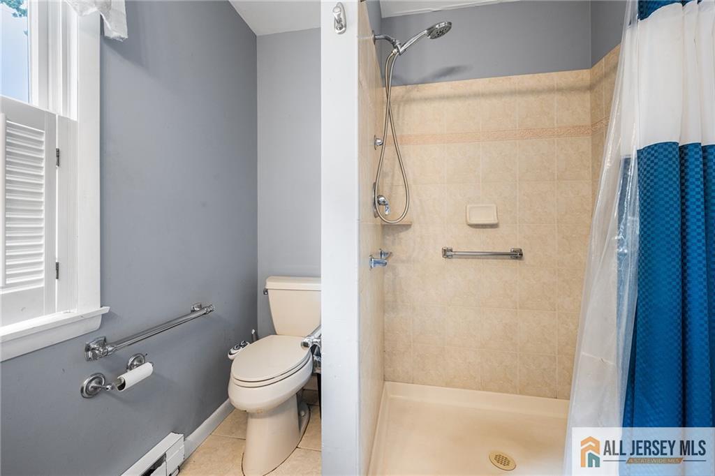 67 Drake Place Colonia, NJ 07067 - Photo 27 of 31 a bathroom with a granite countertop sink toilet and shower