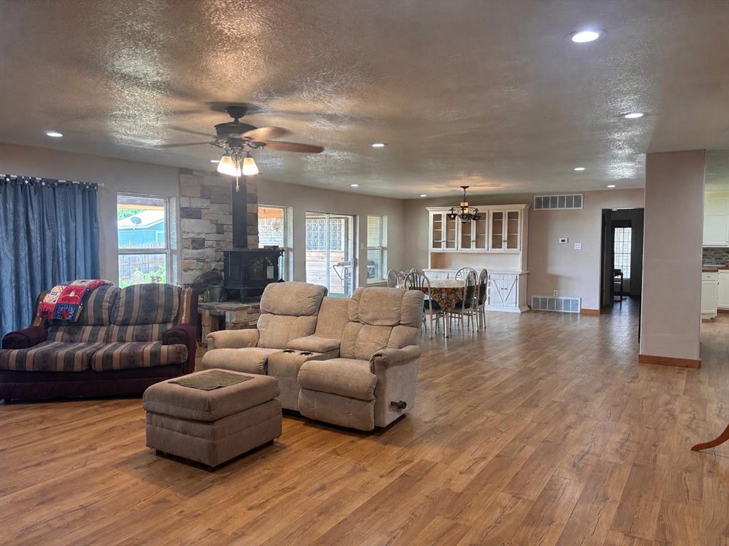 5355 Banks Road Fort Worth, TX 76140 - Photo 15 of 29 a living room with furniture and a wooden floor