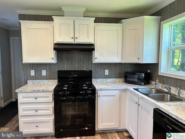 8220 Airport Road Bath, PA 18014 - Photo 13 of 25 a kitchen with granite countertop white cabinets and black appliances