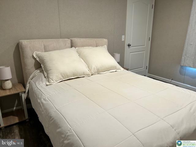 8220 Airport Road Bath, PA 18014 - Photo 18 of 25 a large white bed in a small room