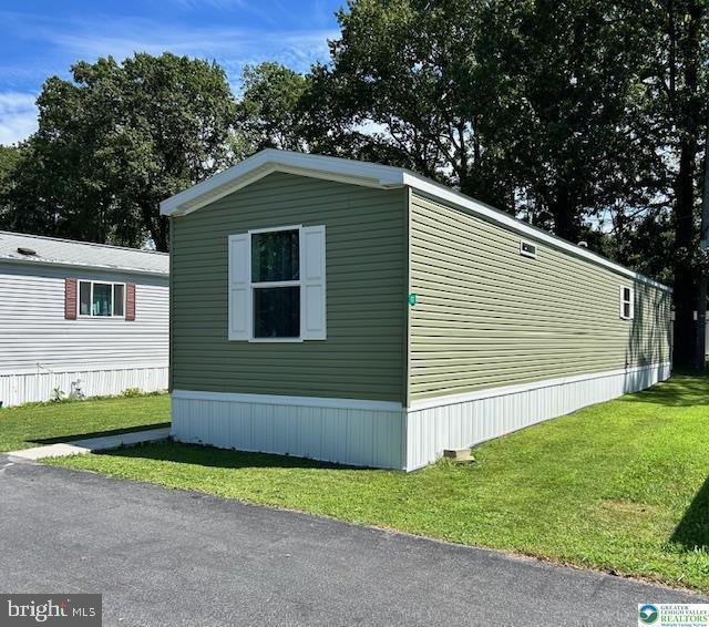 8220 Airport Road Bath, PA 18014 - Photo 4 of 25 a front view of a house with a yard and garage