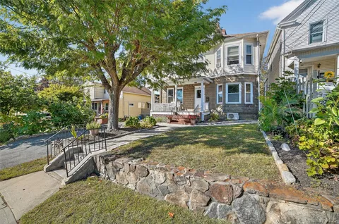a view of a patio with chair and tables back yard of the house